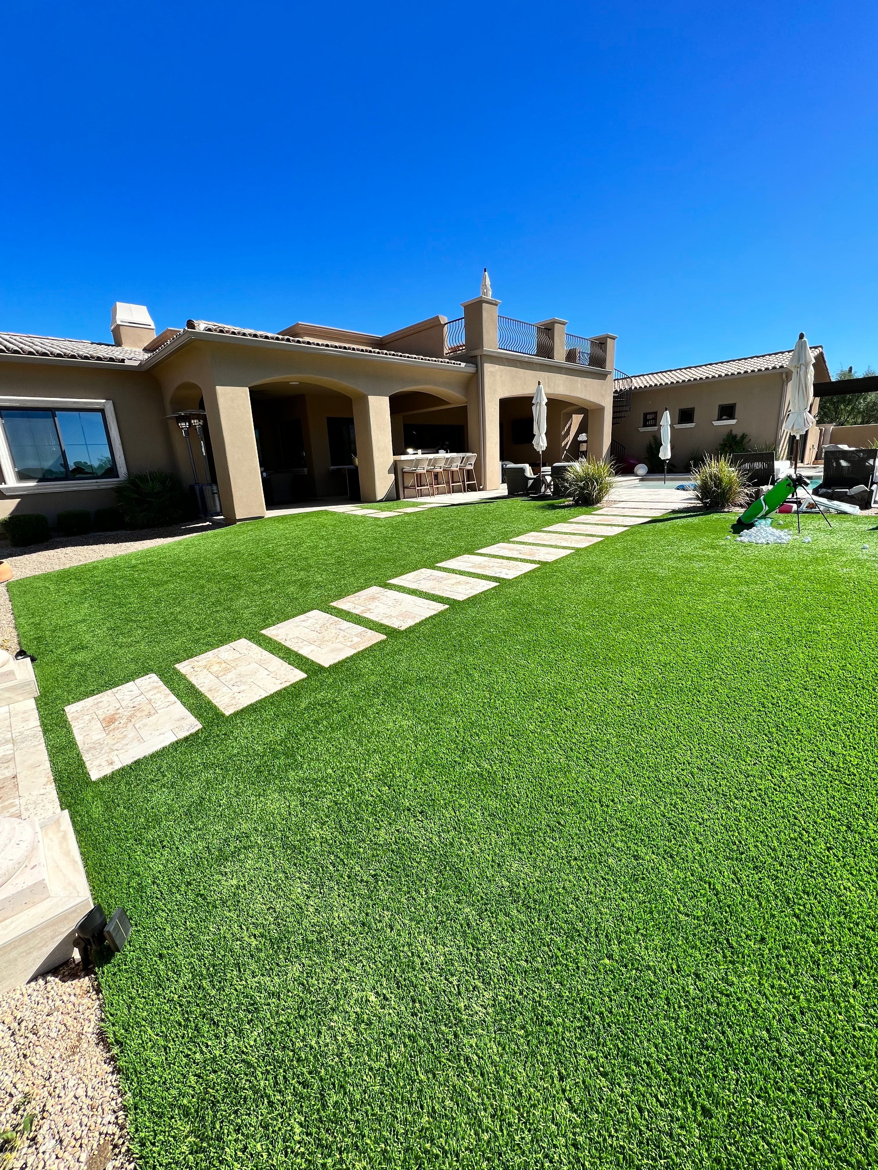Clean, professionally maintained artificial turf backyard by Zeo Turf Cleaning